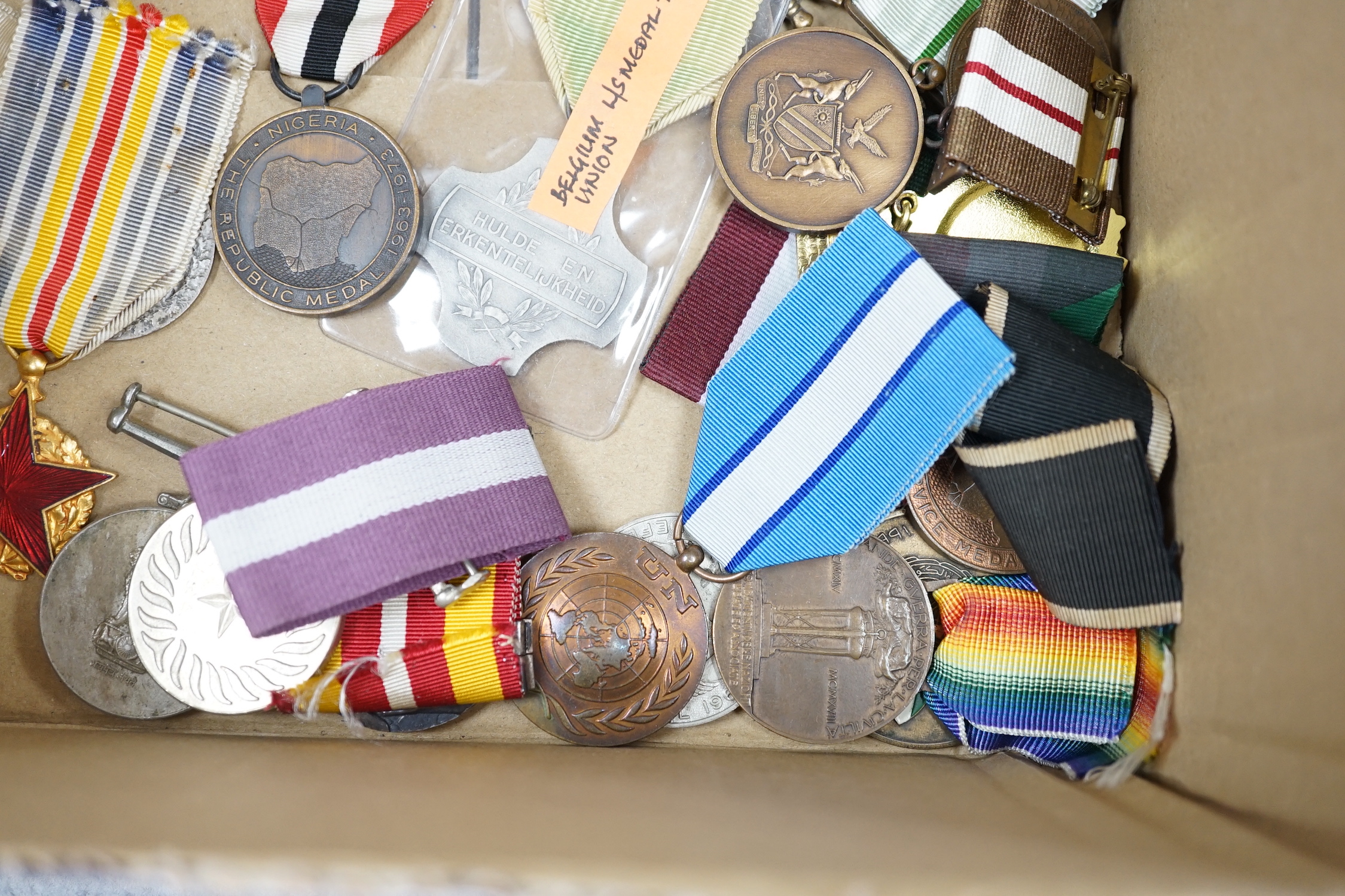 Thirty world military and commemorative medals including; a Belgium War Aid Medal 1914-18, Nigeria Republic Medal, Austri-Hungarian Medal for Bravery, Kuwaiti Liberation Medal, Pakistan Resolution Day Medal, etc.